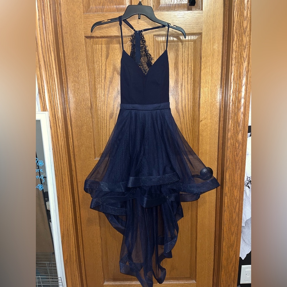 Navy blue City Triangles high-low dress.
Lacey back with a layered tule skirt